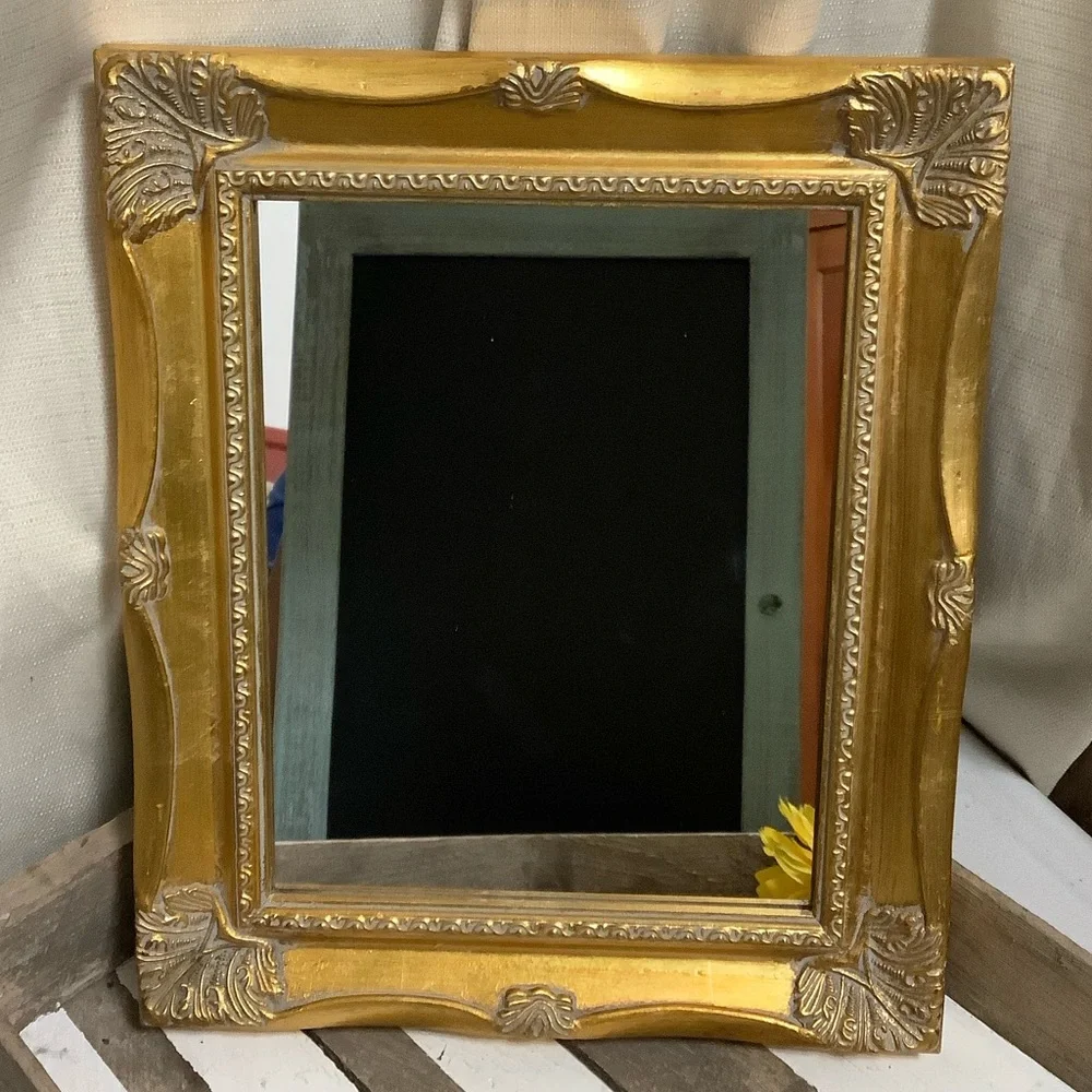 Ornate Gold Wall Mirror with Decorative Frame